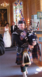 Chris playing bagpipes at wedding